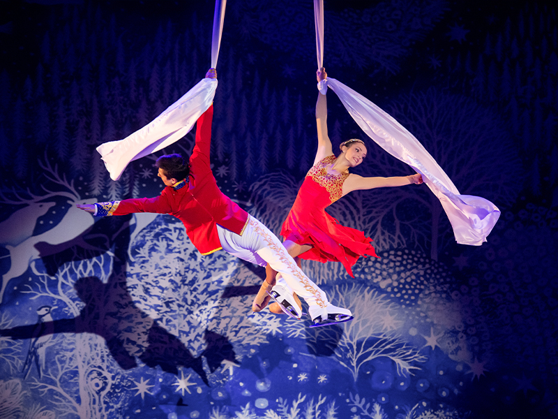 Nutcracker-prince and Marie flying on aerial sils. The Nutcracker Moscow circus on ice