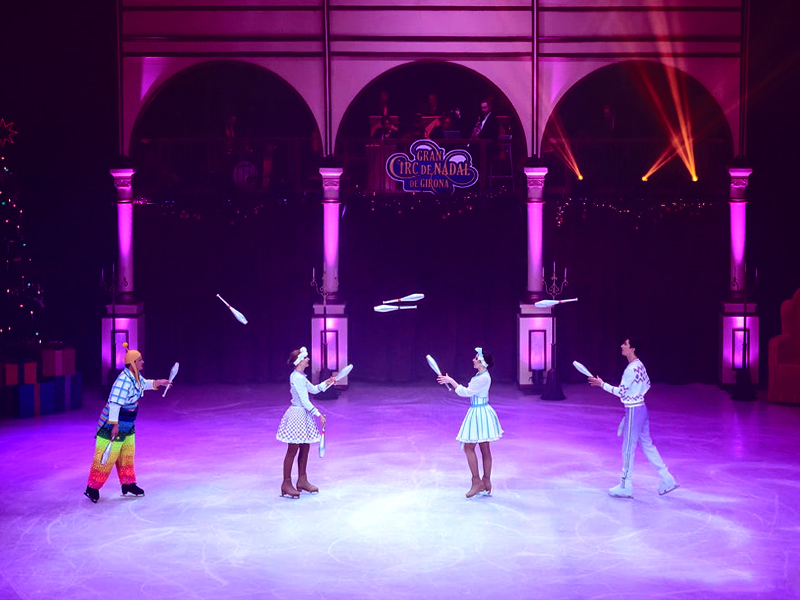 Jugglers throwing clubs. The Nutcracker by Moscow circus on ice